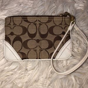 White & brown coach monogram wristlet